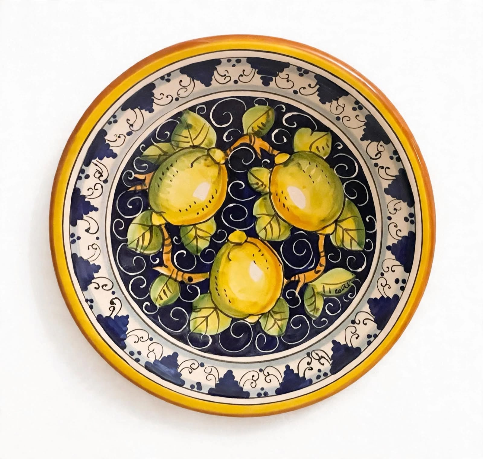 Piatto limoni fondo blu e Monticini bordo arancio 